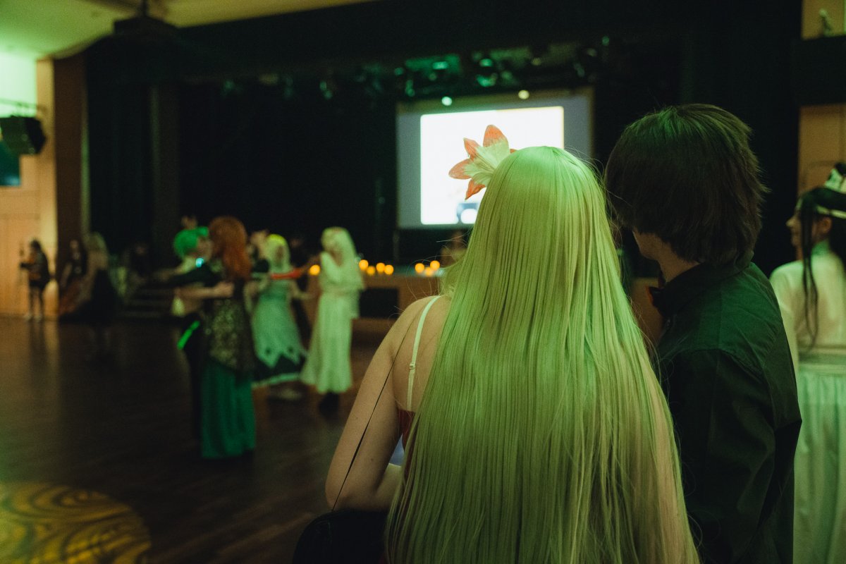 Cosplay ball with guests dancing in costume