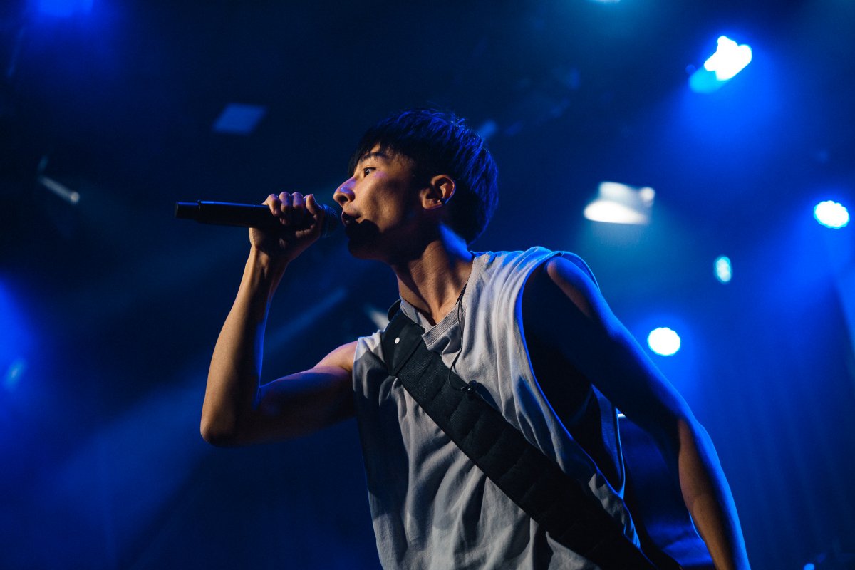 Singer with microphone in the stage lights